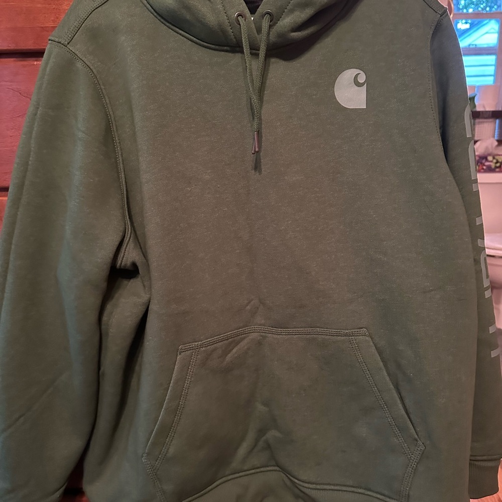 Like new women’s Carhartt logo sweatshirt in a sage green color size XXL.